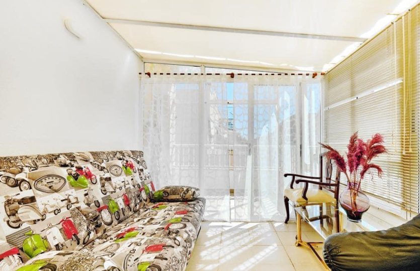 Apartment Torrevieja close to the sea enclosed balcony with sofa and relaxation area